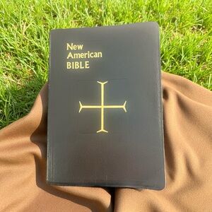 New American Bible with Gold Cross